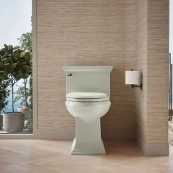 One-piece compact elongated toilet with skirted trapway, 1.28 gpf^Kohler Best