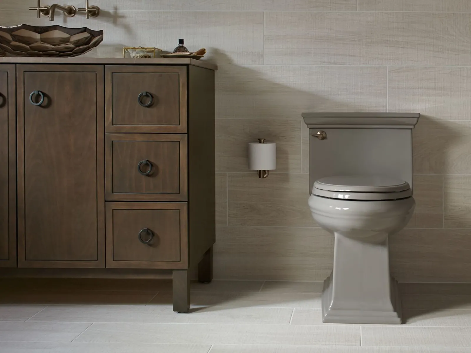One-piece compact elongated toilet with skirted trapway, 1.28 gpf^Kohler Best