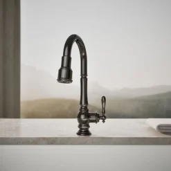Pull-down kitchen sink faucet with three-function sprayhead^Kohler