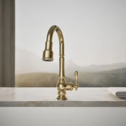 Pull-down kitchen sink faucet with three-function sprayhead^Kohler