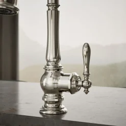 Pull-down kitchen sink faucet with three-function sprayhead^Kohler