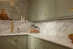 Pull-down kitchen sink faucet with three-function sprayhead^Kohler
