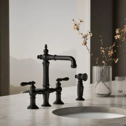 Three-hole bridge bar sink faucet with side sprayer^Kohler Outlet