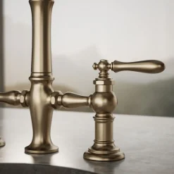 Three-hole bridge bar sink faucet with side sprayer^Kohler Outlet