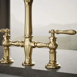 Three-hole bridge kitchen sink faucet with side sprayer^Kohler Outlet