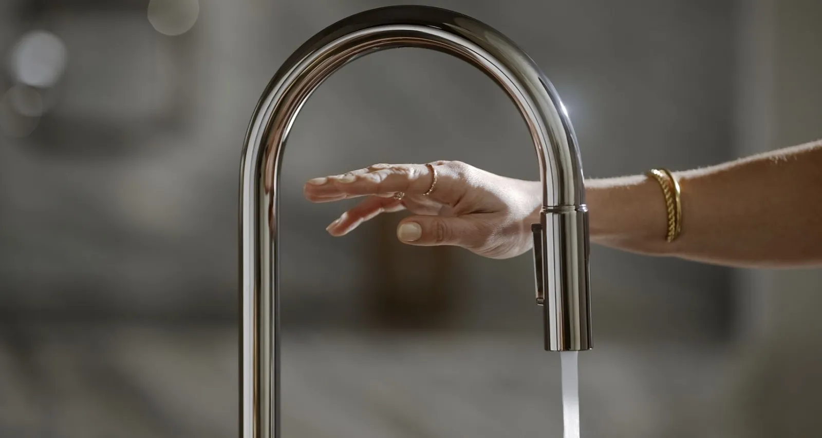 Touchless pull-down kitchen sink faucet with two-function sprayhead^Kohler