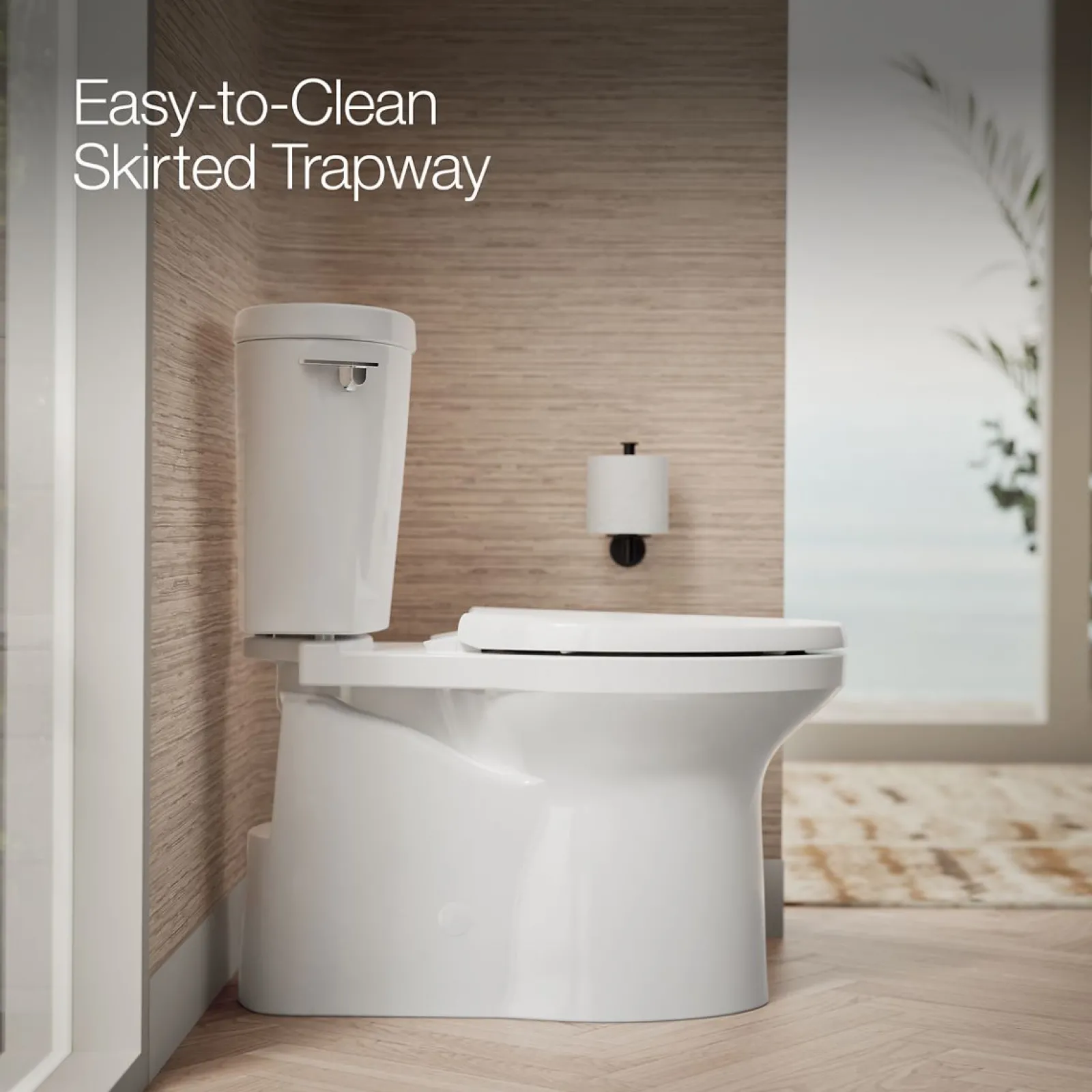 Two-piece elongated toilet with skirted trapway, 1.28 gpf^Kohler Clearance
