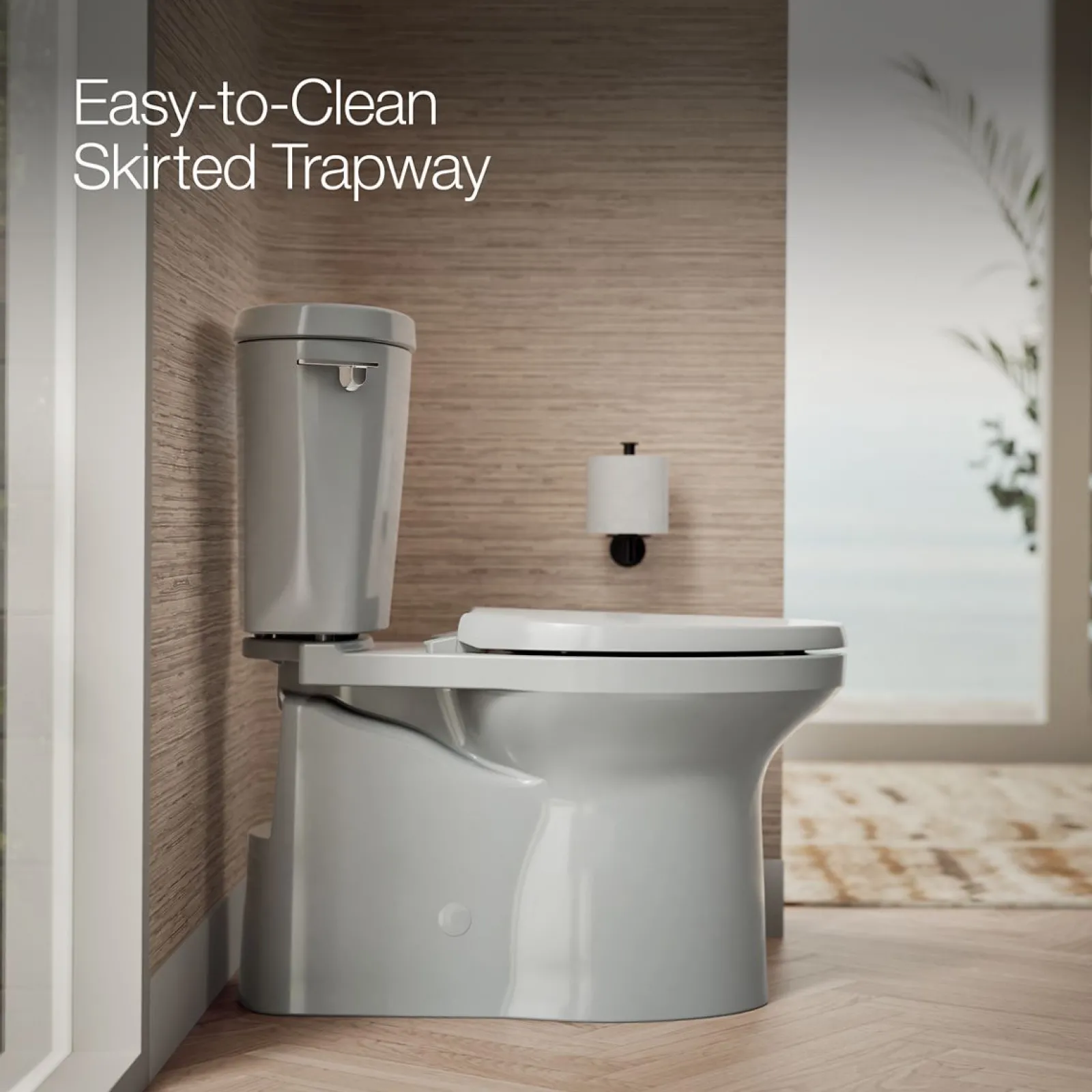 Two-piece elongated toilet with skirted trapway, 1.28 gpf^Kohler Clearance