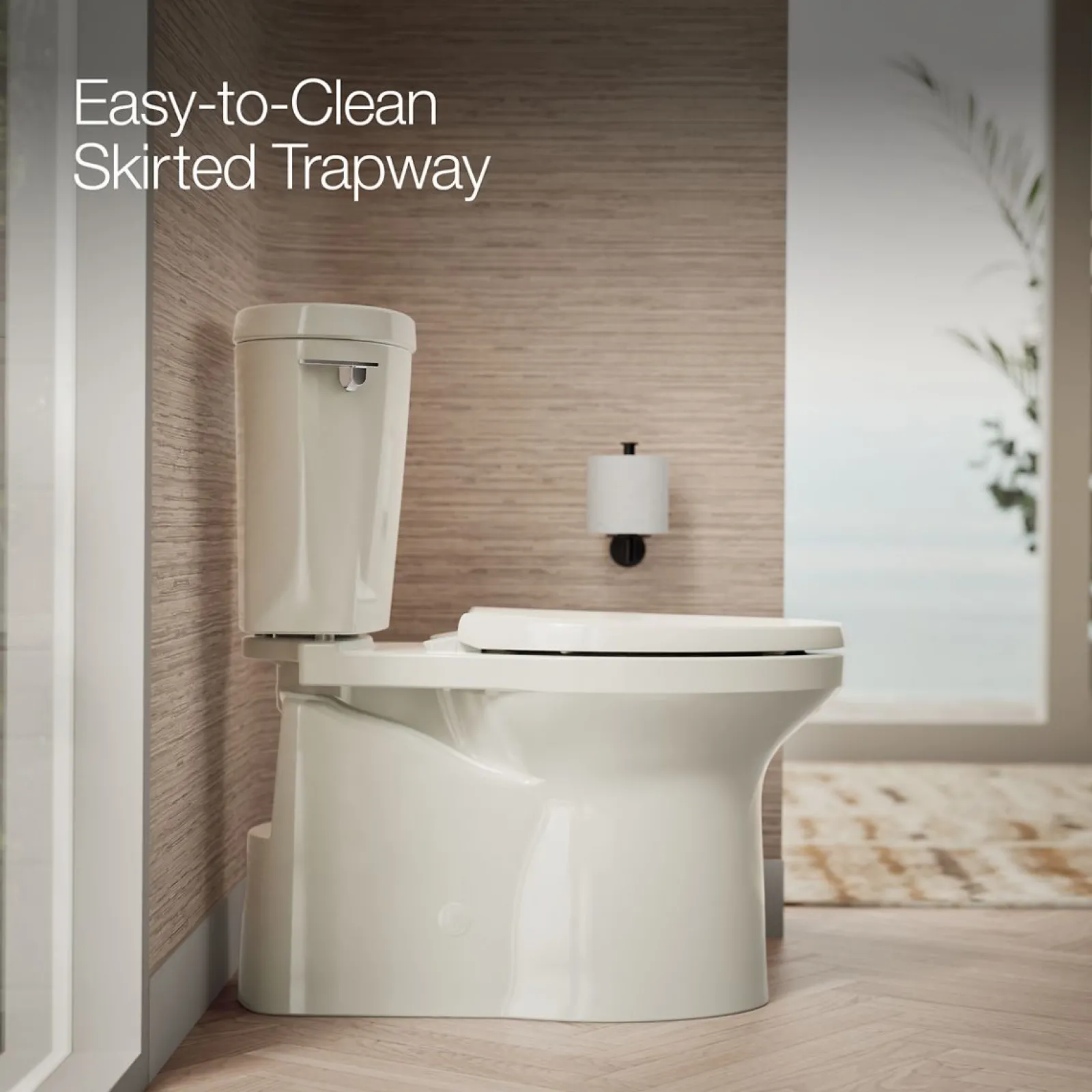 Two-piece elongated toilet with skirted trapway, 1.28 gpf^Kohler Clearance