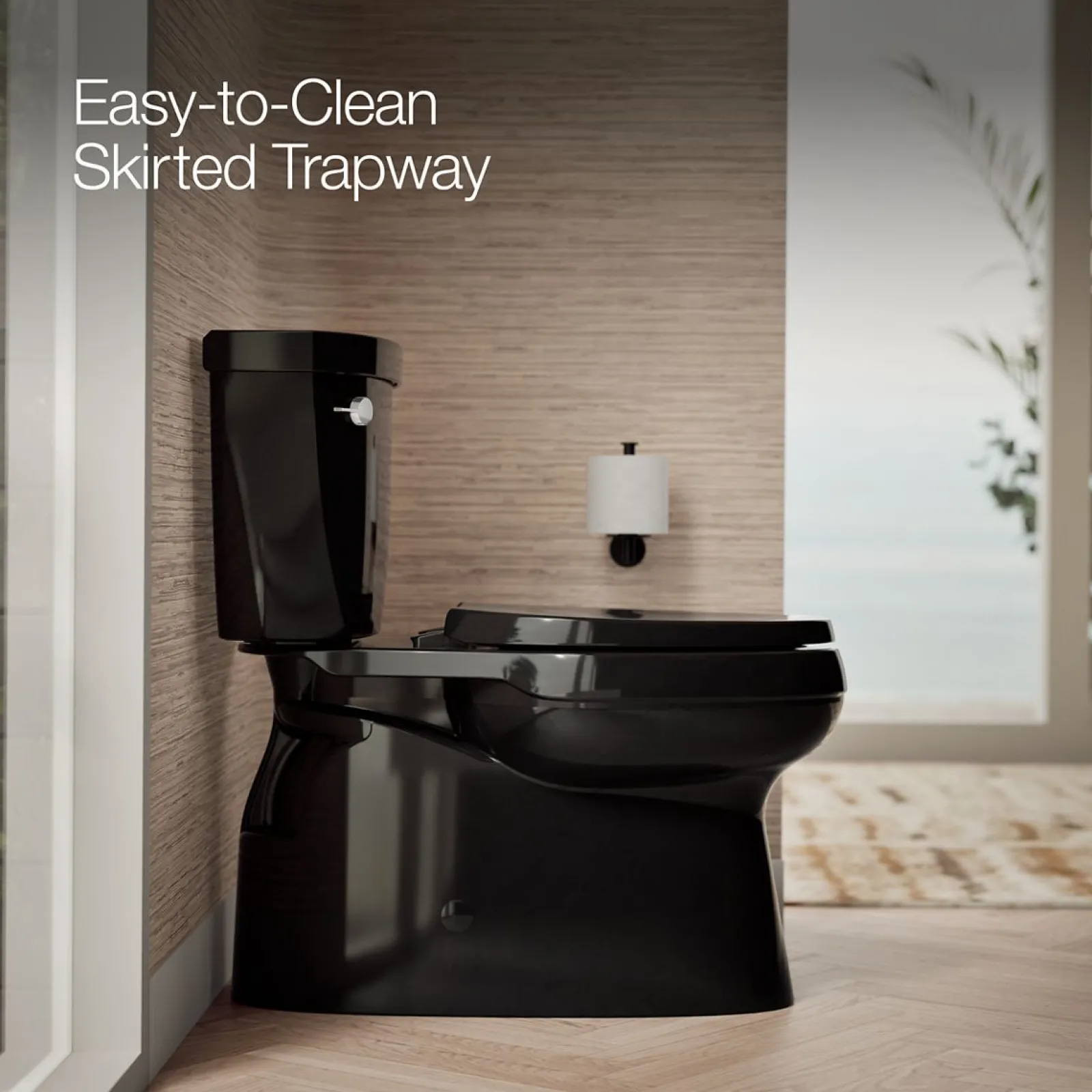 Two-piece elongated toilet with skirted trapway, 1.28 gpf^Kohler
