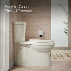Two-piece elongated toilet with skirted trapway, 1.28 gpf^Kohler